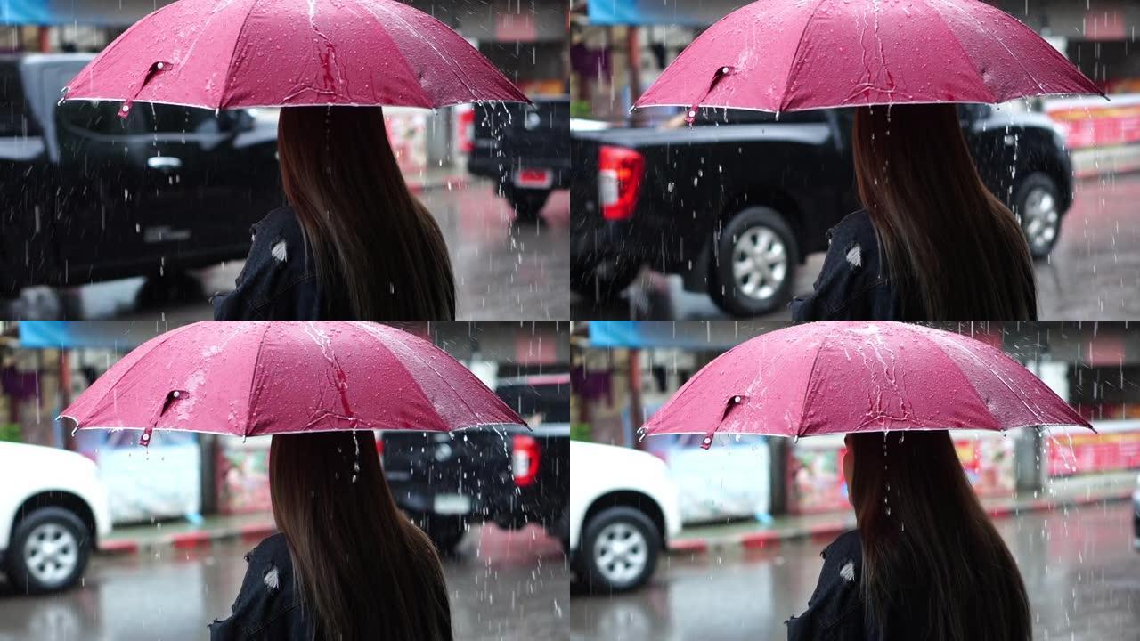 一女子在雨天撑伞慢动作