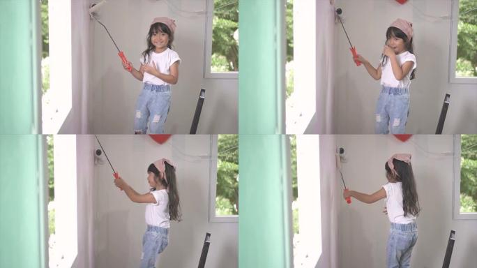 可爱的小女孩喜欢粉刷她的房间
