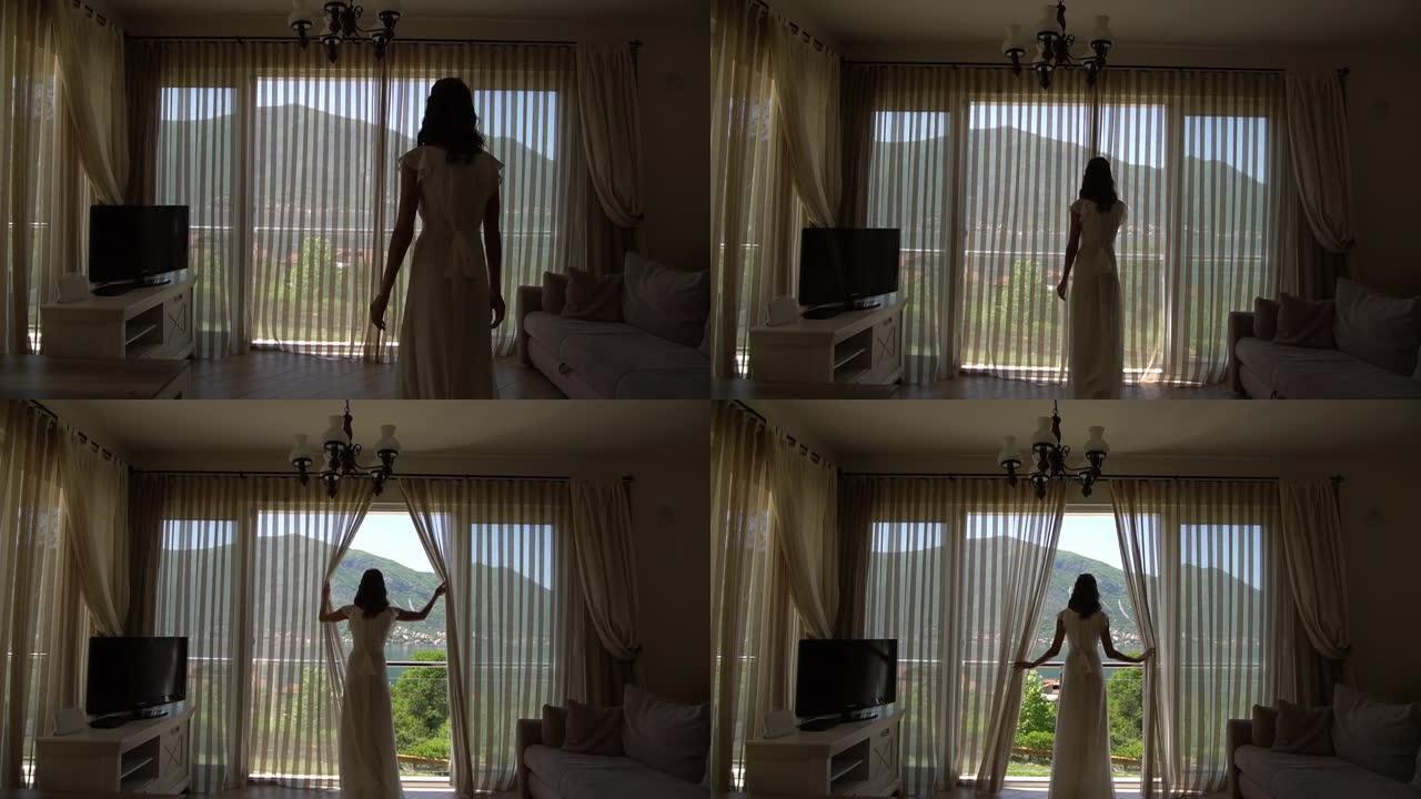 酒店房间里的新娘来到窗户前，打开窗帘