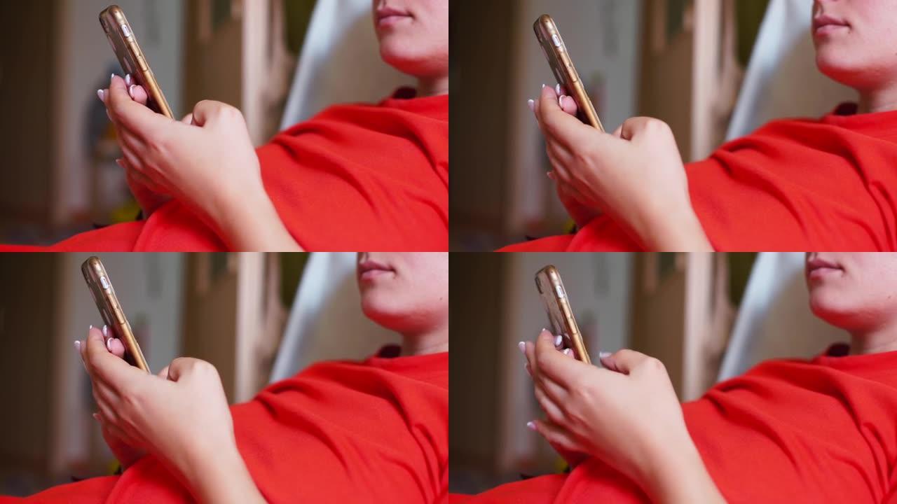 穿红色衣服的女孩用手中的电话。拖延。