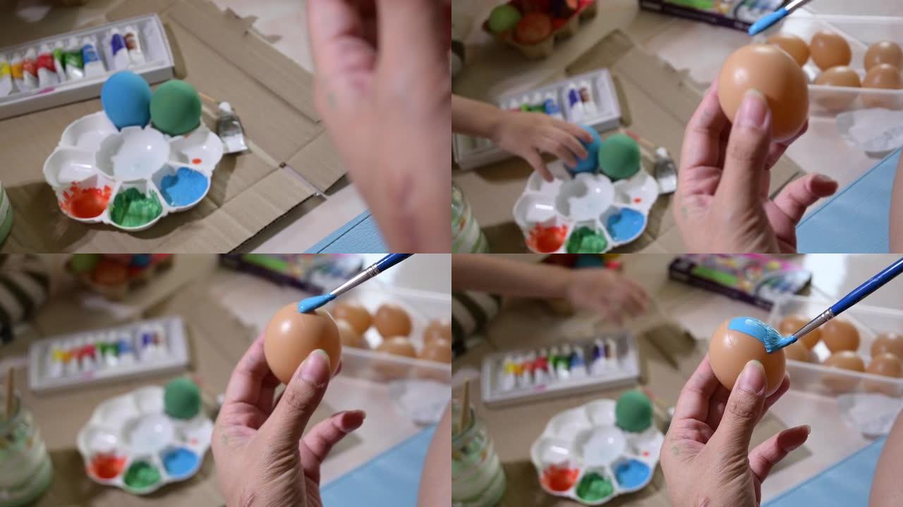 人们用毛笔画蓝色复活节彩蛋工艺品