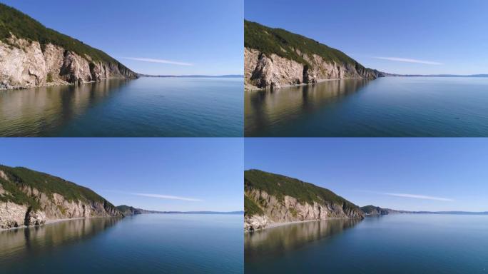 俯瞰绿色山岛和深蓝色海水的鸟瞰图。FHD视频。背景