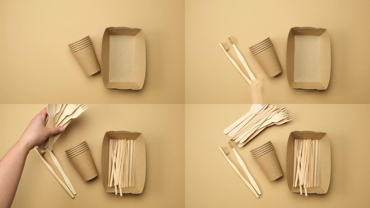 女性手放一次性纸盘和杯子、木叉和牙刷