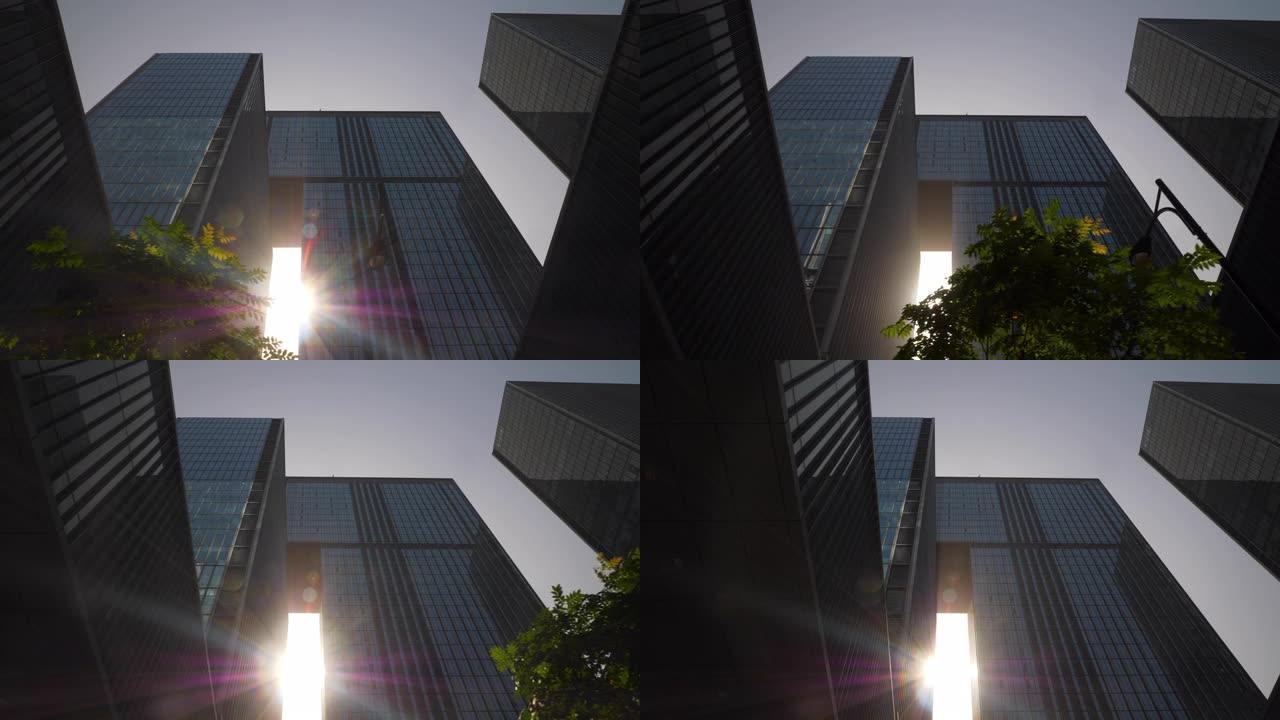 阳光明媚的日子杭州市区现代办公大楼前慢动作向上视图4k中国