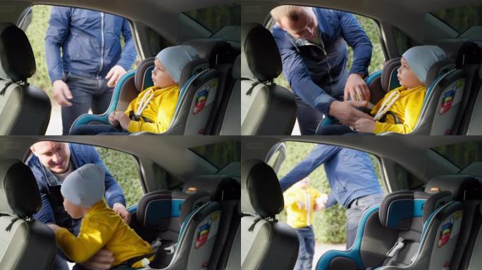 注意事项，充满爱心的男性父母在城镇周围开车后解开孩子的安全带并采取措施离开汽车安全座椅