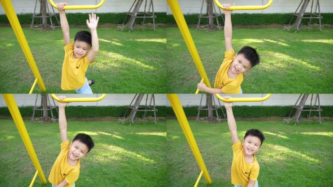 亚洲孩子在操场上玩耍。学习户外和快乐的理念