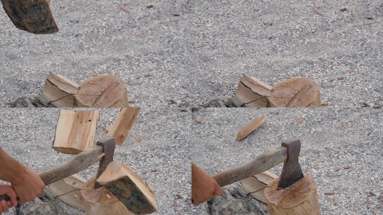 用大锋利斧头切割木材。男子在沙滩上砍柴