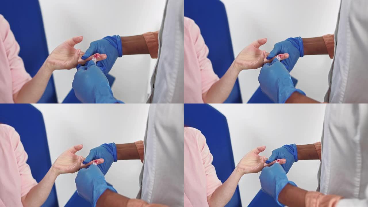 手指血液测试。手戴手套采集血样的特写镜头。血液测试的特写。护士从男性手上抽血。医学检测艾滋病毒。护士