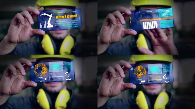 工厂工人使用未来的全息屏幕设备来控制制造