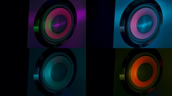 黑色振动膜的宏观特写彩色霓虹灯中的响亮声音扬声器。特写。慢动作