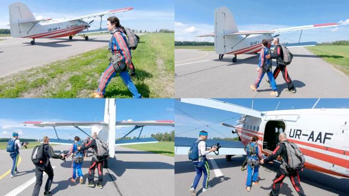 跳伞运动员在飞机场的跑道上登上飞机。