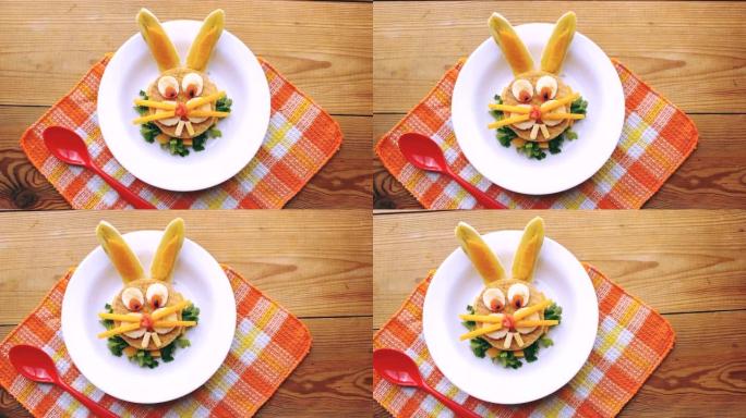 以兔子滑稽脸的形状制作的蔬菜三明治。