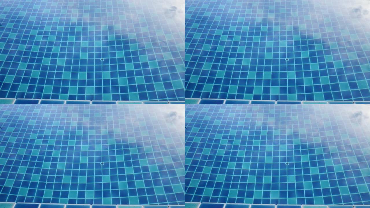 游泳池中清澈的绿松石涟漪背景