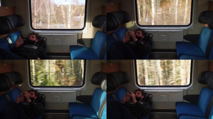 一个人在旅行火车上的交流。使用移动应用程序。