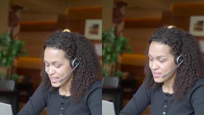 垂直视频-带笔记本电脑的非裔美国妇女正在进行在线对话