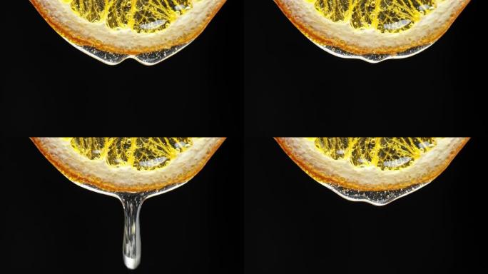蜂蜜从新鲜的柠檬片上滴下来的宏观纹理镜头。新鲜、柑橘和流感补救概念。