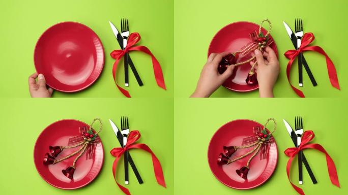 红色圆板，带叉子的刀和绿色背景上的圣诞节装饰