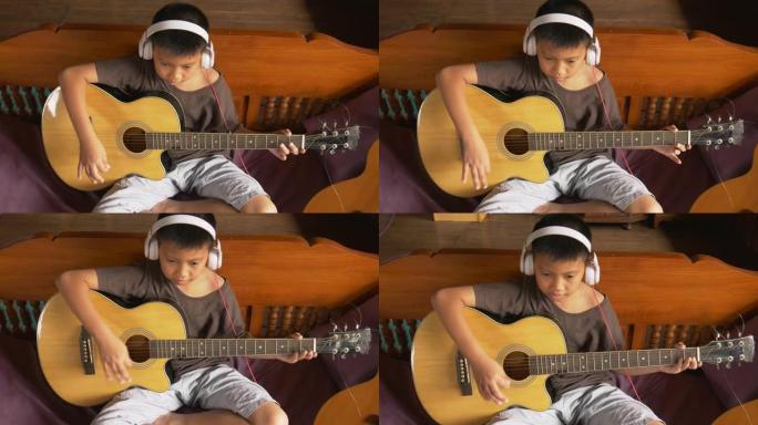 男孩学弹古典吉他