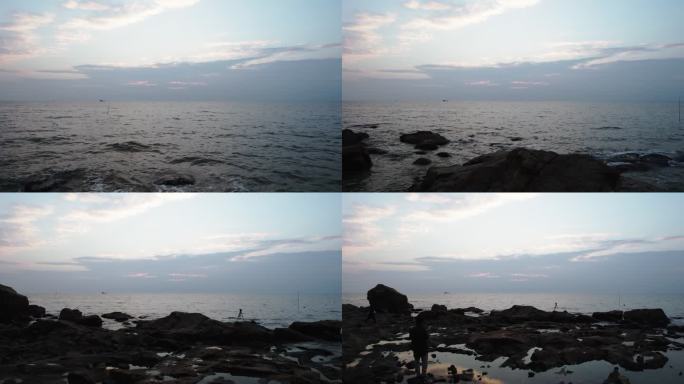 海边看日出的摄影师