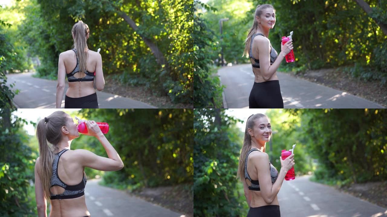 手持式的效果。女人早上锻炼后喝红色的水。