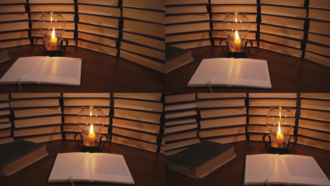 打开书和燃烧的蜡烛