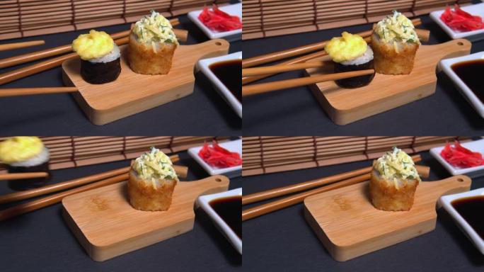 筷子寿司卷特写。烤沙司卷