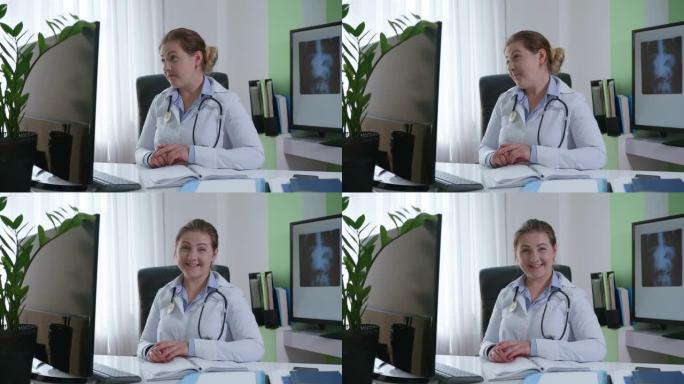 女医生用语音内窥镜看着网络摄像头提供远程医疗辅助虚拟聊天，医务人员视频通话在线咨询患者