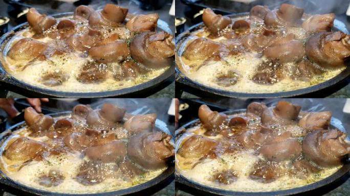 蘑菇在黄油酱中煮沸并煮沸特写