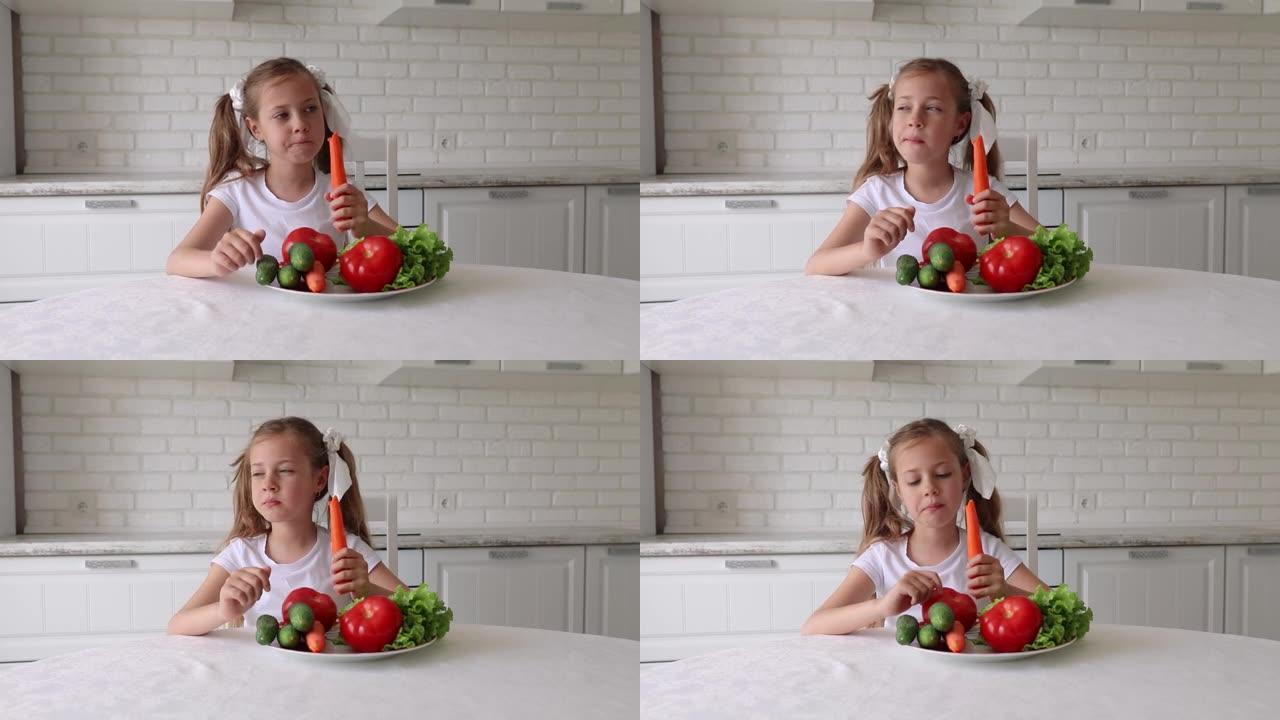 孩子高兴地吃蔬菜。小女孩在厨房里吃胡萝卜。健康饮食的概念