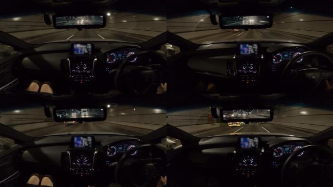 公路旅行中的夫妇，车辆视点通过隧道行驶，驾驶员视点的宽图像视图