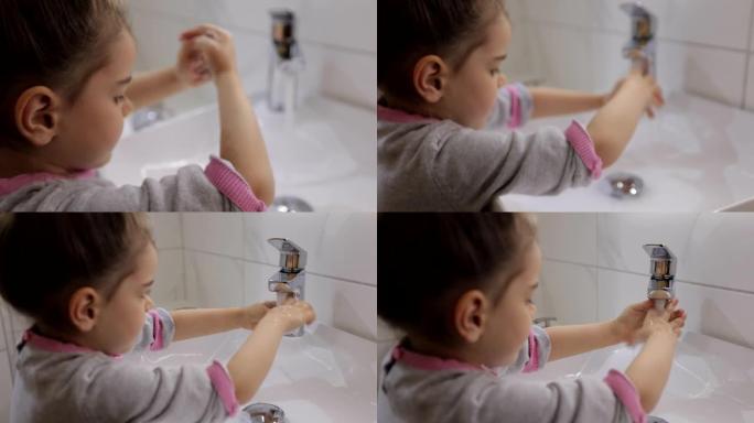 可爱的小女孩在家饭前洗手