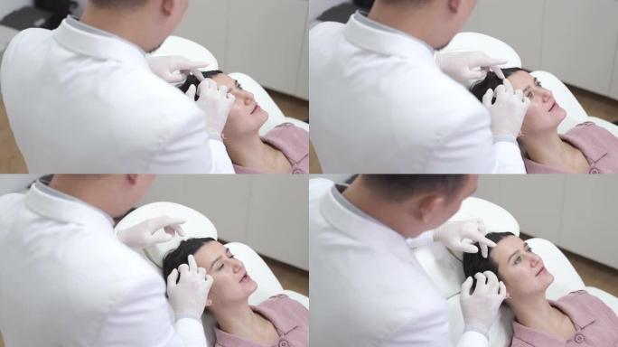 医生医生检查妇女的头皮是否有湿疹，皮炎，牛皮癣，脱发，头皮屑或头皮干燥问题