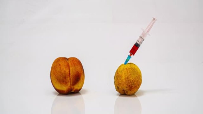 用注射器注射腐烂桃子的时间流逝，毒瘾的危害概念和坏习惯对身体的有害影响