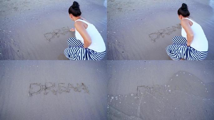 岸上女性的后景。女人在海边的沙滩上写梦这个词。水浪冲走了文字。顶视图。