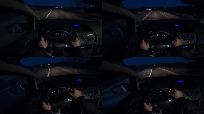 夜间驾驶-从驾驶员的角度使用gopro摄像机拍摄的夜间在空旷的道路上行驶的汽车的视频4k镜头