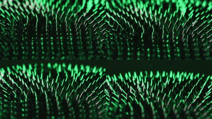 在钕磁铁的作用下，铁磁流体物质上的磁性和绿光可以产生令人印象深刻的视觉效果。VJ，科幻小说和抽象艺术