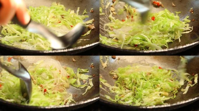 平底锅用粉丝油炸切碎的卷心菜