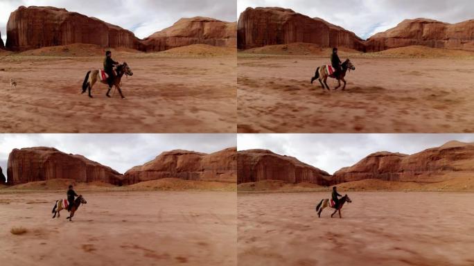 纳瓦霍族男孩在纪念碑谷骑马的移动镜头。