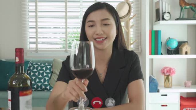 亚洲女性虚拟欢乐时光聚会和与她的朋友一起在视频会议上与数字平板电脑在线喝红葡萄酒，在视频会议中进行在