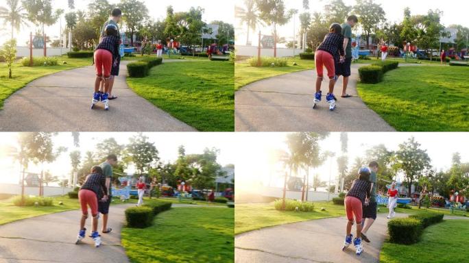 亚洲男孩教他的妹妹在公园里用太阳光玩旱冰鞋，生活方式概念。