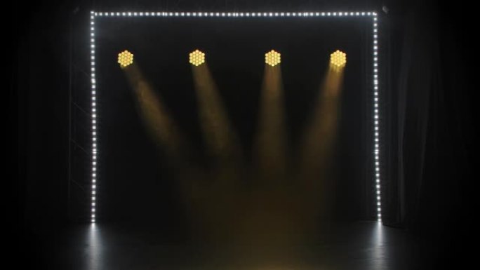 演播室闪耀着舞台黄灯。照明设备。灯光效果。假日、表演或戏剧表演的概念