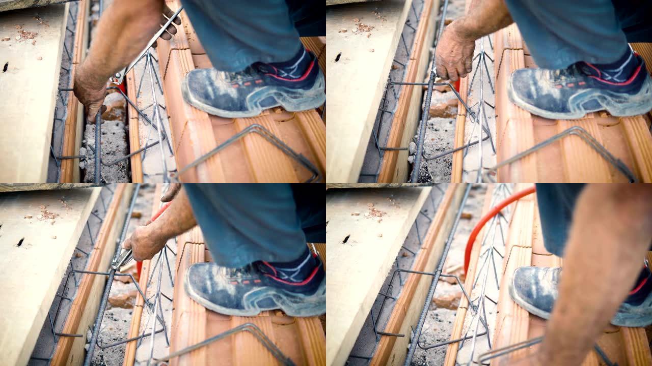 棒材弯曲手用绑扎线固定钢筋的特写镜头
