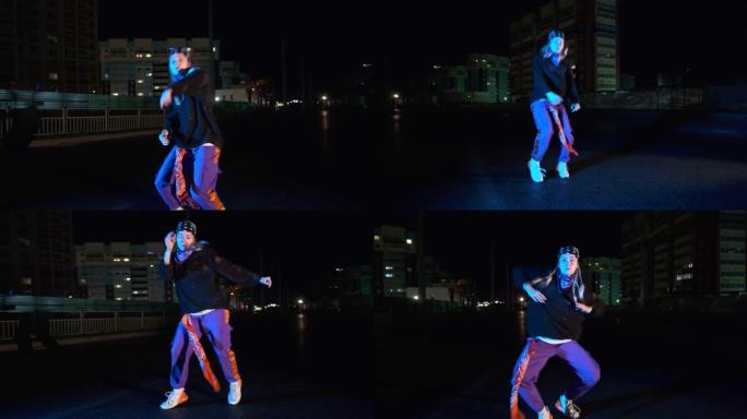 时尚的年轻女子跳舞嘻哈，晚上在户外跳街舞。青年亚文化。万向节射击