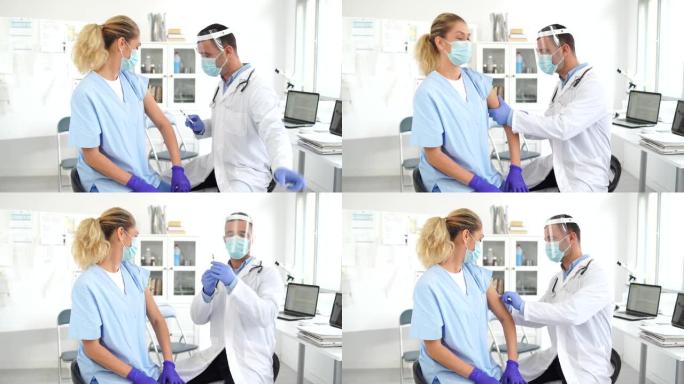 4k视频: 医生穿防护服给医务人员注射新型冠状病毒肺炎疫苗