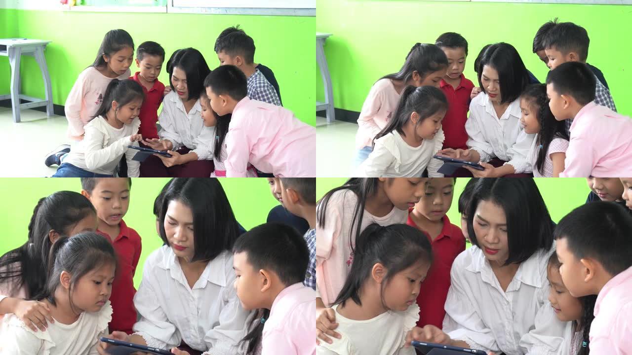 亚洲女性教学和学校教室里的孩子。
