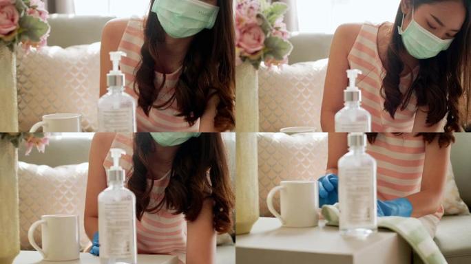 在家清洁口罩的女管家。女佣戴着防护面具和橡胶手套打扫房间。家庭清洁服务新型冠状病毒肺炎概念。