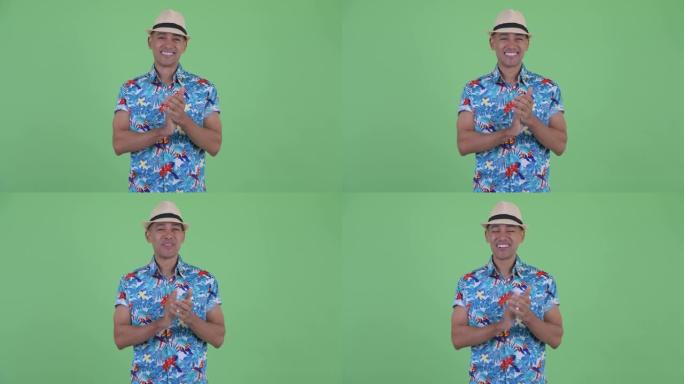 英俊的多民族旅游男子准备度假