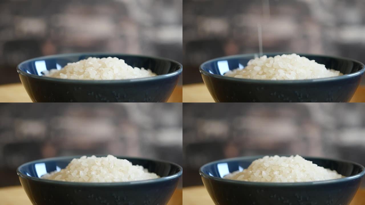 精米。碗里新鲜生米的视频。