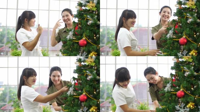 聋哑女孩在装饰圣诞树时玩得开心