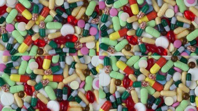 不同颜色的医用药丸的俯视图呈圆形旋转。药丸和毒品。医药行业。